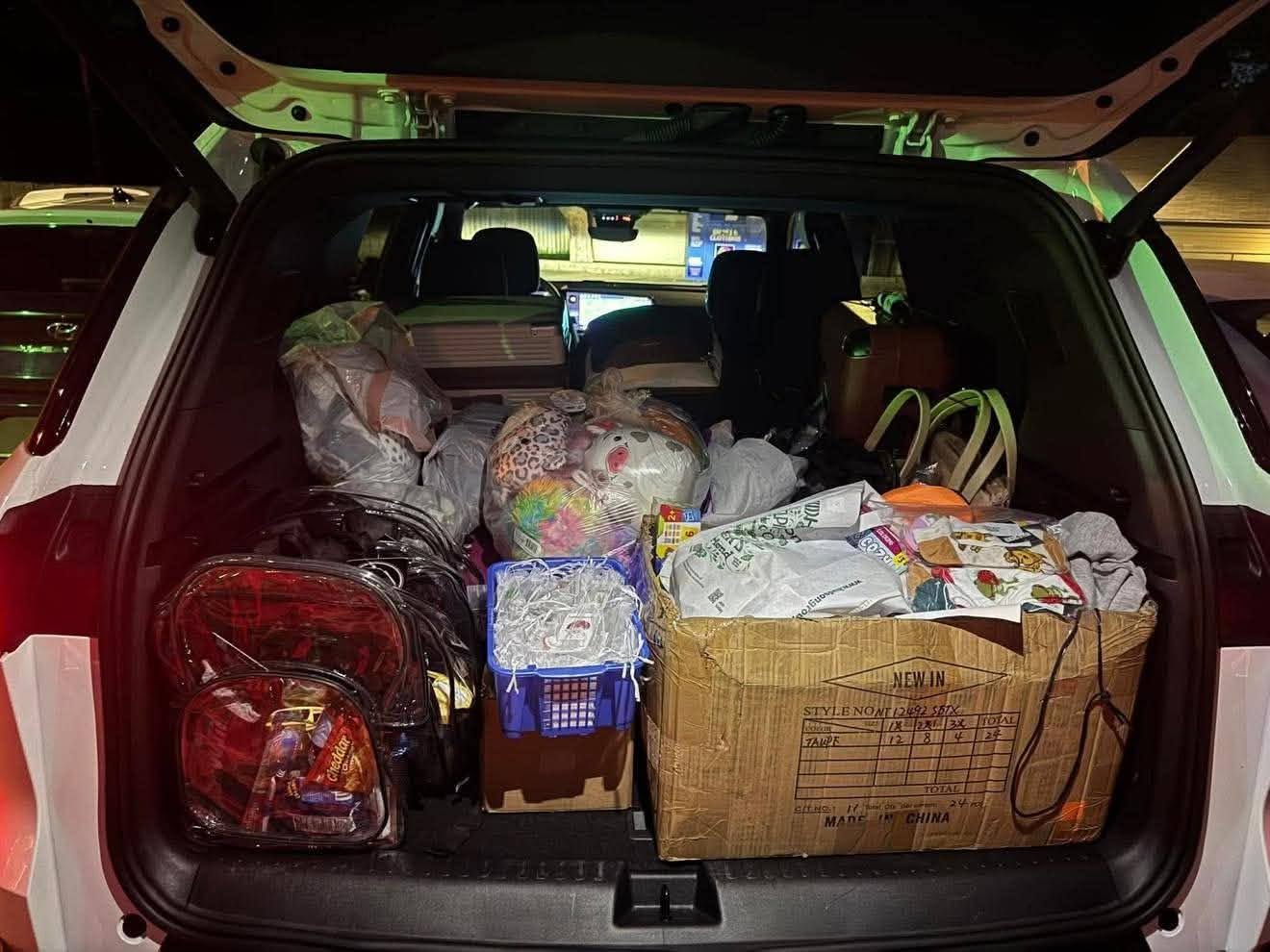 Car loaded with RISE, water, and supplies for the shelter